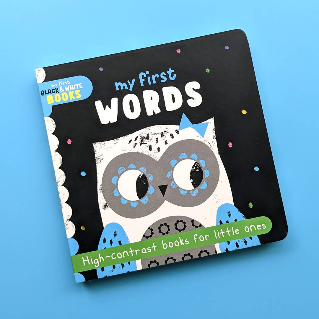 A black and white board book titled 'my first words' with an illustration of an owl on the cover, designed for little ones with high contrast books.