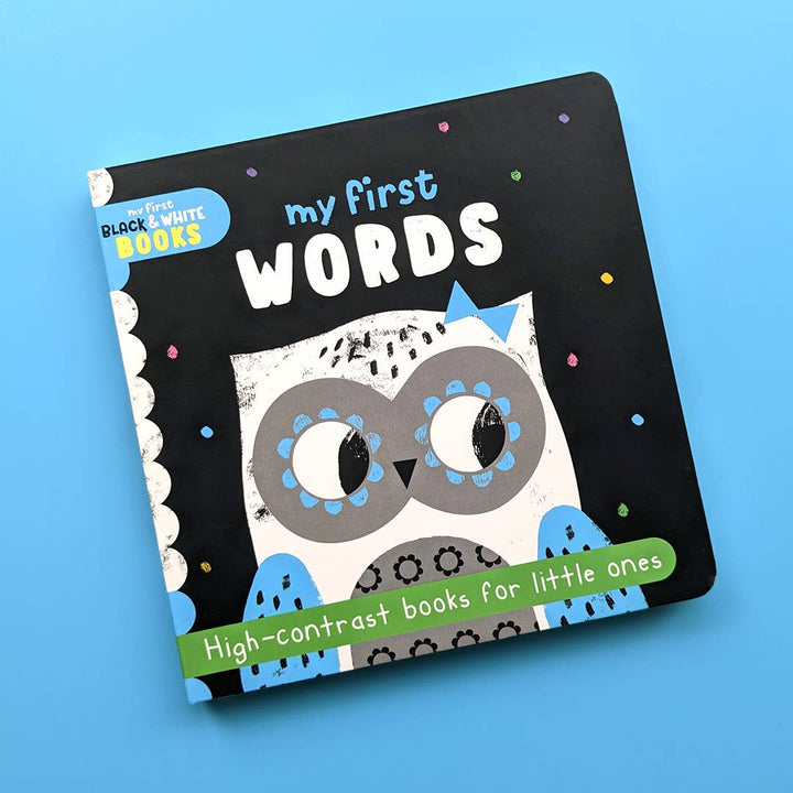 A black and white board book titled 'my first words' with an illustration of an owl on the cover, designed for little ones with high contrast books.
