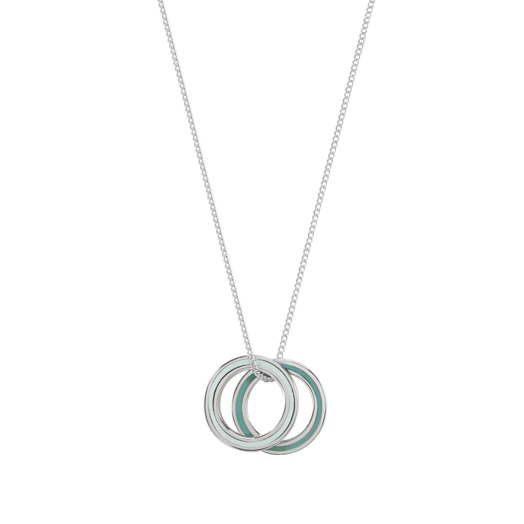 Necklace with two interlocking rings, one silver and one green, on a white background.