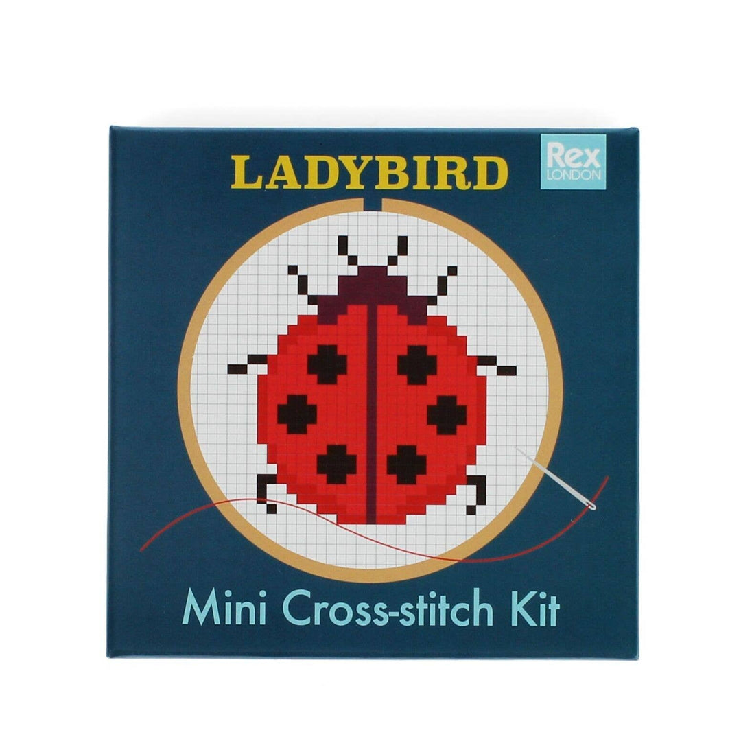 LADYBIRD mini cross-stitch kit packaging with a ladybug design on a blue background