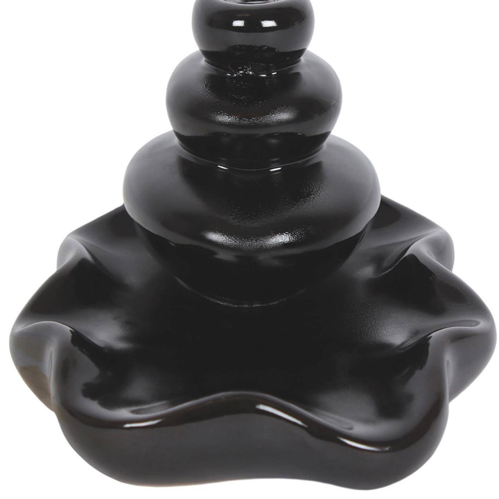 Black ceramic back flow burner fountain.
