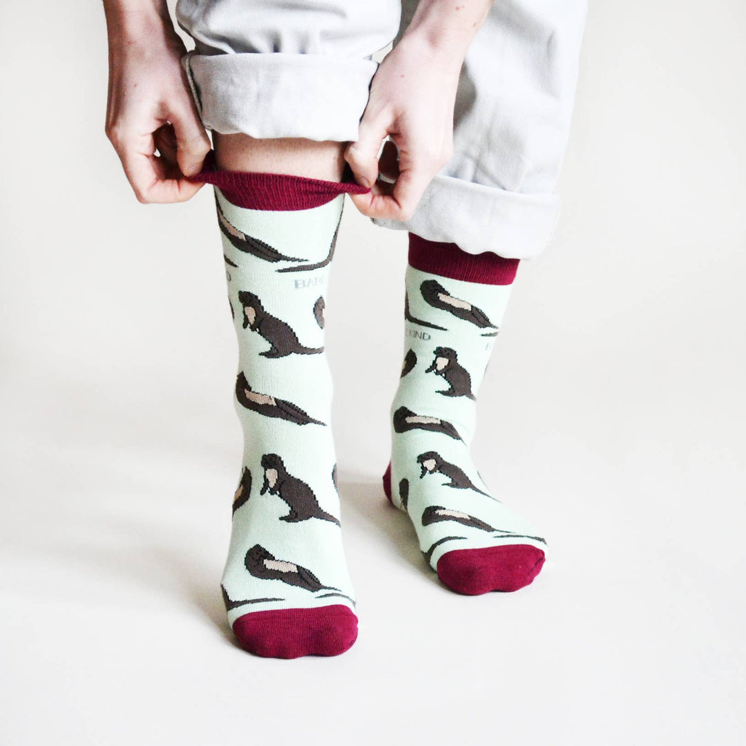 Bamboo socks with otter print on light blue and burgundy socks.