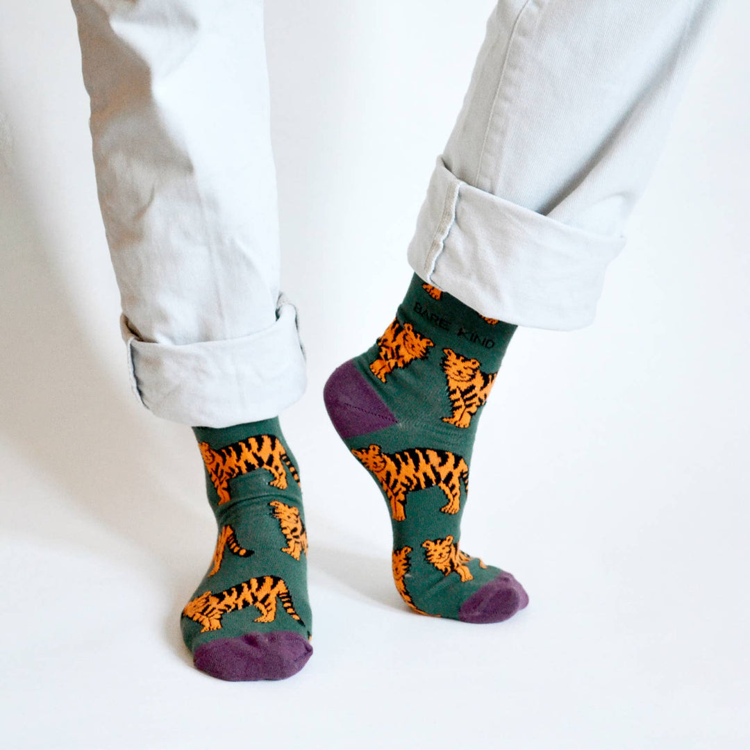 Bamboo socks with tiger print on green and purple socks.