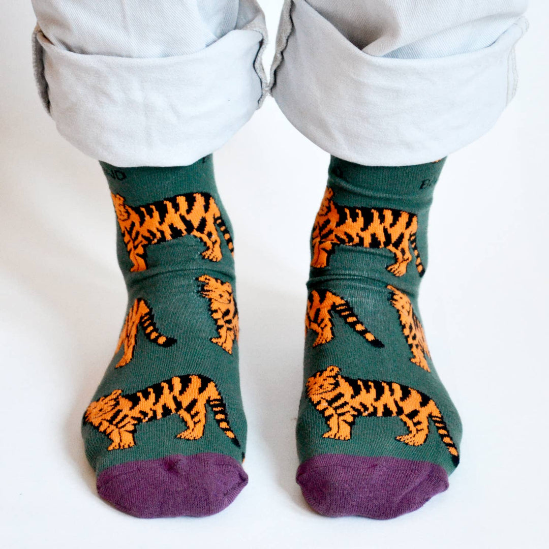 Bamboo socks with tiger print on green and purple socks.