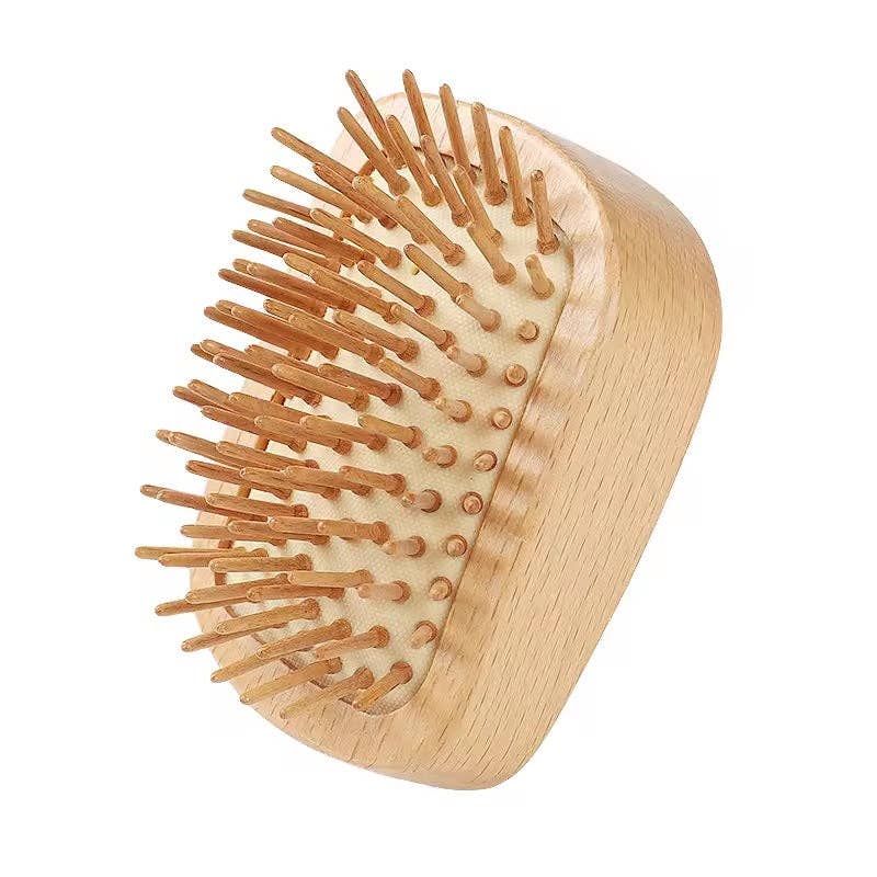 Wooden hairbrush with bristle design on a white background