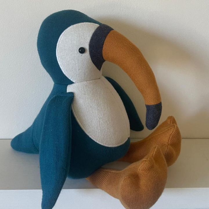 Knitted Organic Toucan Soft Toy in Blue with a white chest and yellow beak. From Best Year Toys.