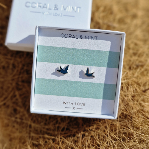 Box of earrings with &