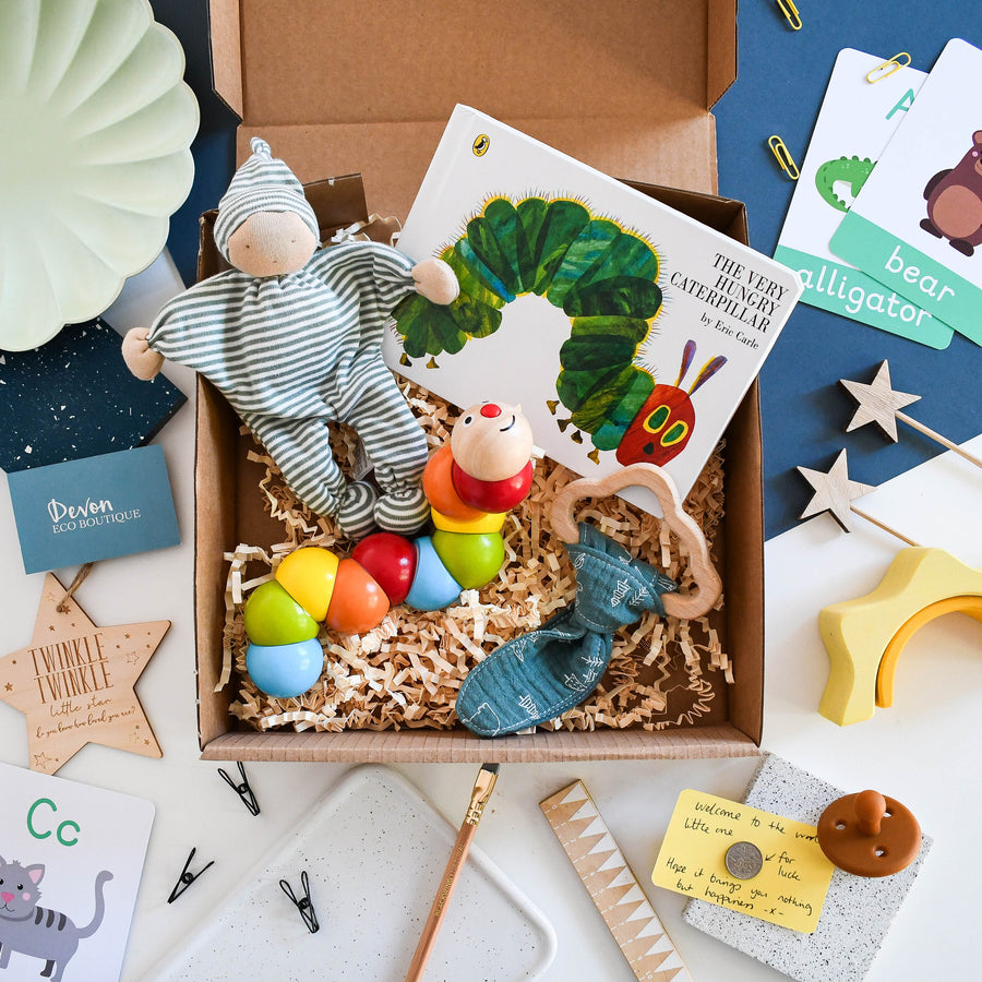 Eco Friendly New Baby gift box - Little caterpillar. Includes the hungry caterpillar board book, wooden rainbow classic world toy, striped comforter plush and wooden teether.