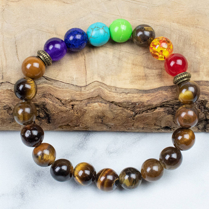 Focus Bracelet - Has Tigers Eye and the Seven Chakras. Manifest your destiny by embracing wisdom-filled paths and fostering transformative, positive shifts in your spiritual journey
