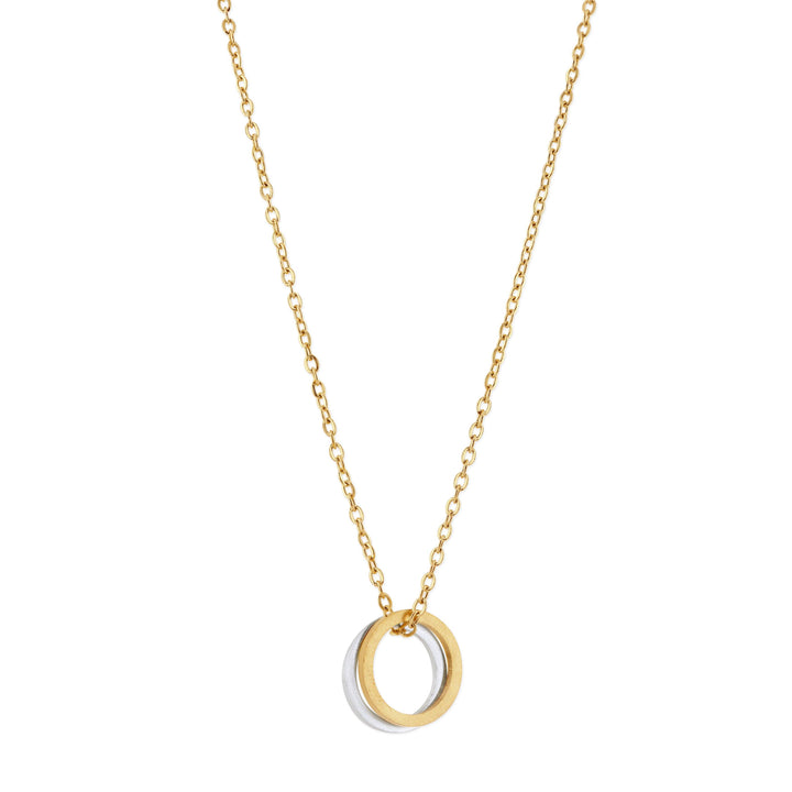 Gold necklace with a circular silver &amp; gold pendant on a white background