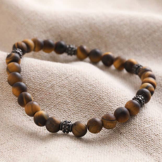 semi-precious tiger's eye beads (Kambaba jasper beads in deep greens and greys) are interspersed by grey metal spacers, giving this piece a masculine finish.