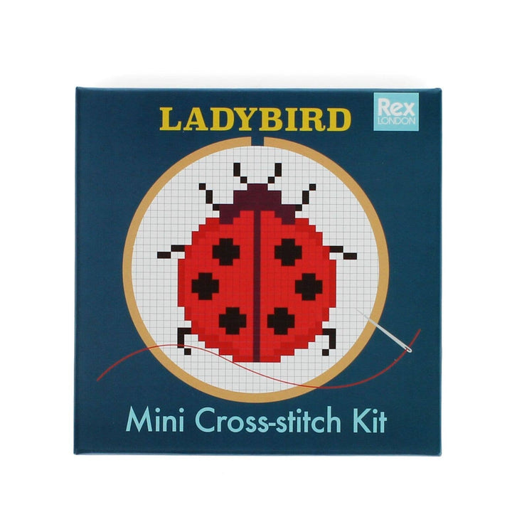 LADYBIRD mini cross-stitch kit packaging with a ladybug design on a blue background