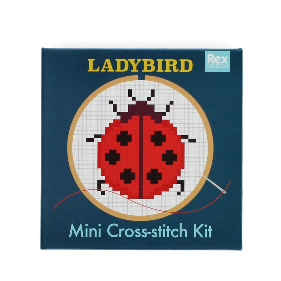 LADYBIRD mini cross-stitch kit packaging with a ladybug design on a blue background