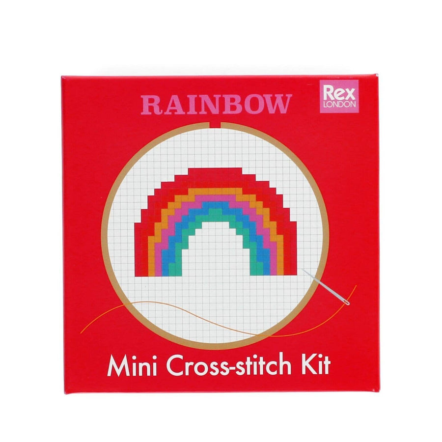 Red box of a mini cross-stitch kit with a rainbow design on a white background