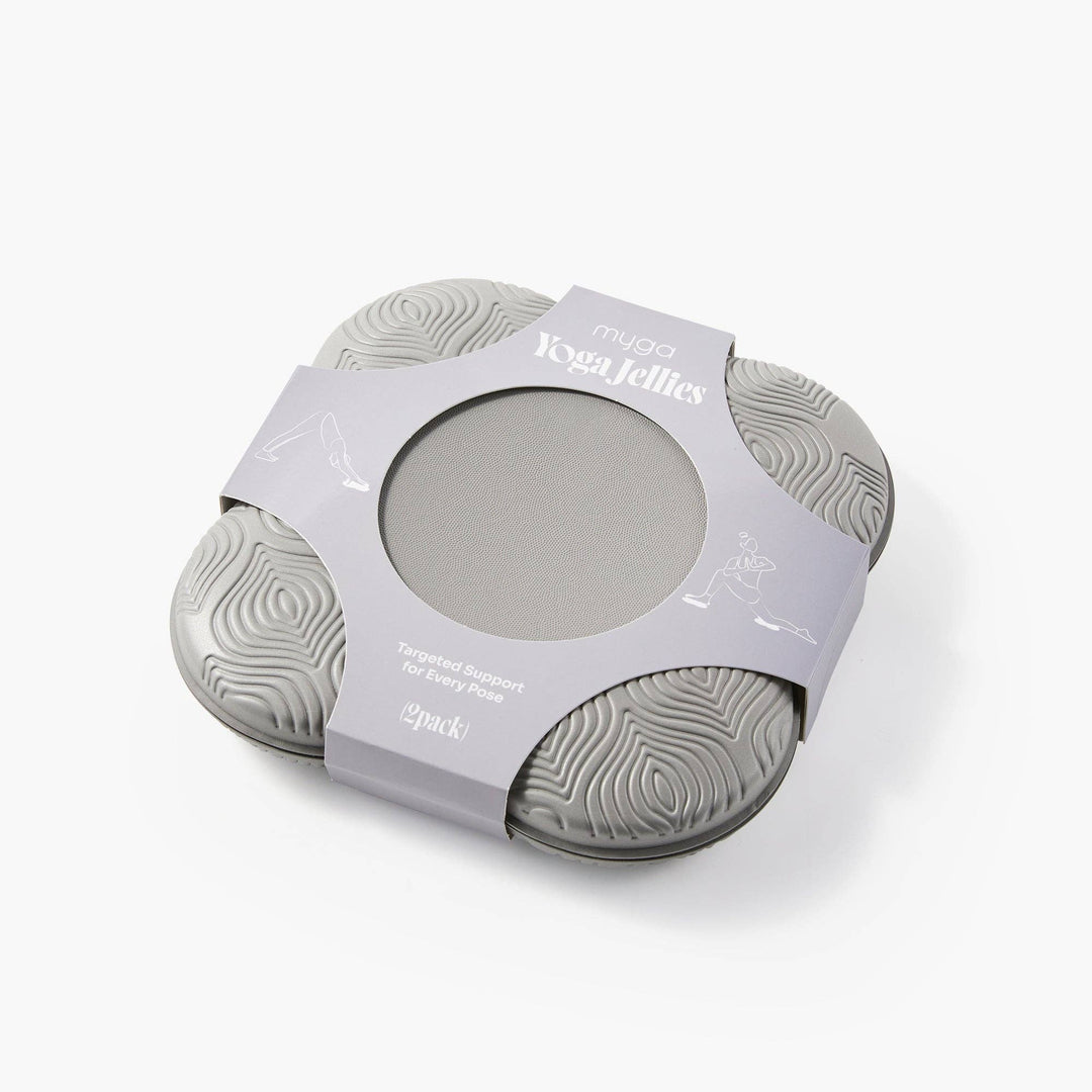 Two gray silicone yoga jellies in packaging on a white background