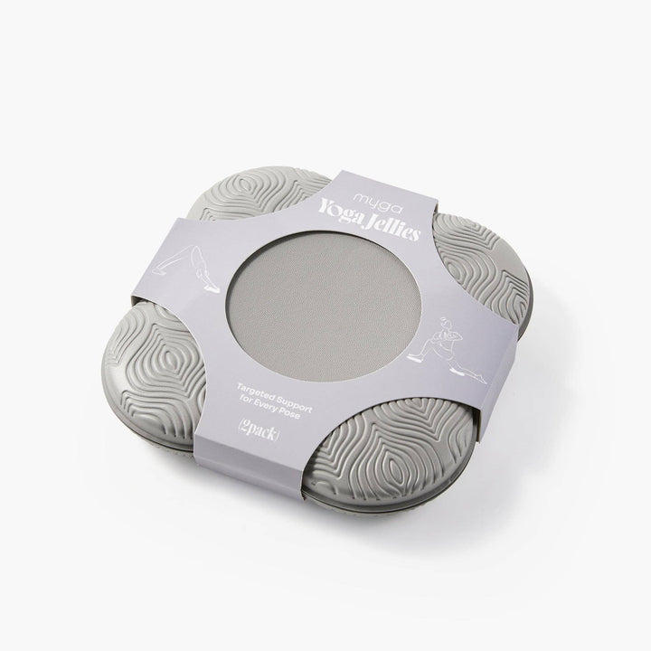Two gray silicone yoga jellies in packaging on a white background