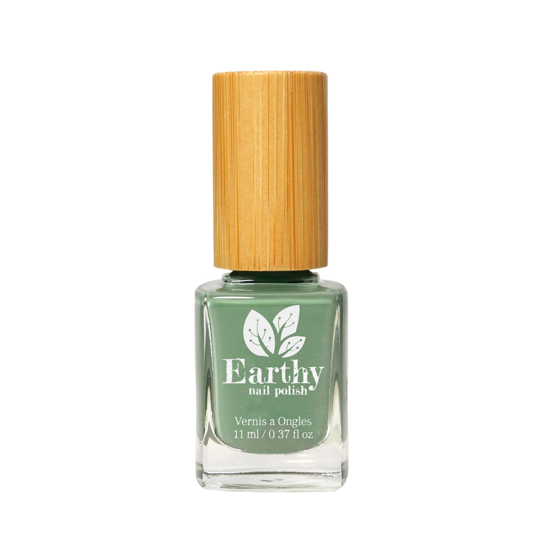 Green nail polish bottle with a bamboo cap on a white background