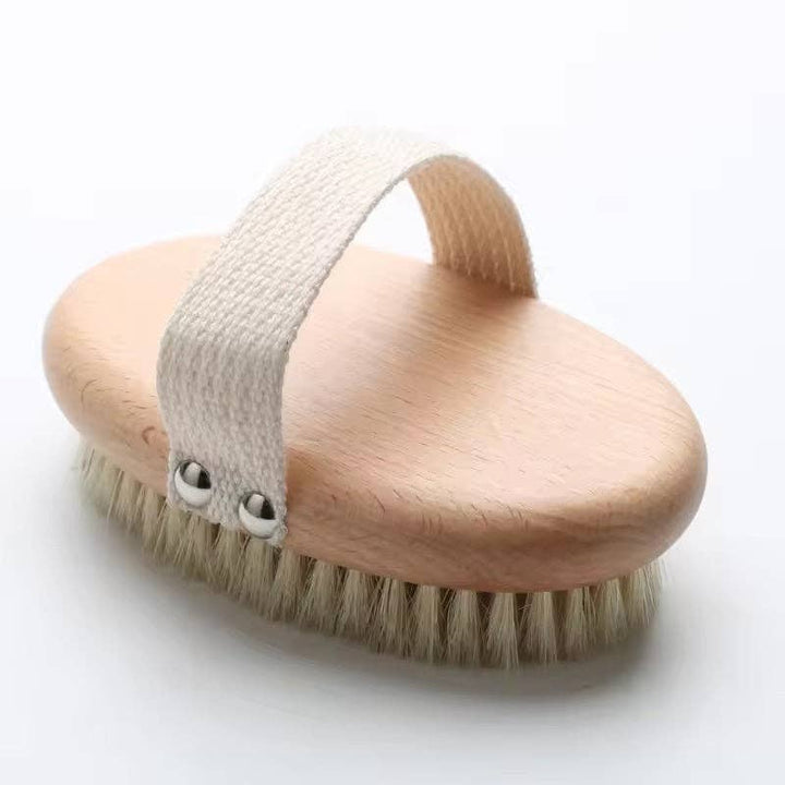 Wooden brush with a textured handle on a white background