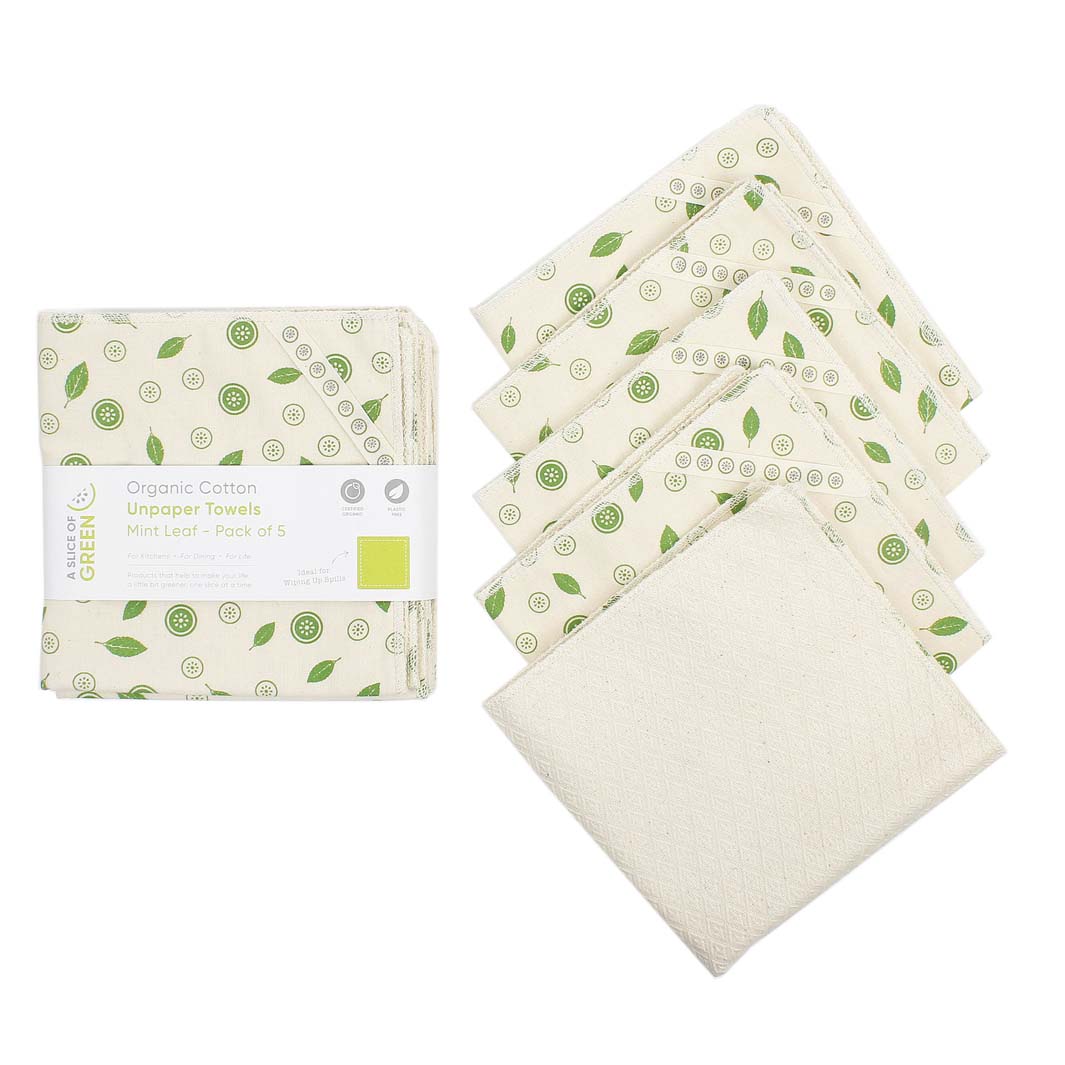 Set of organic cotton towels with green leaf pattern on a white background