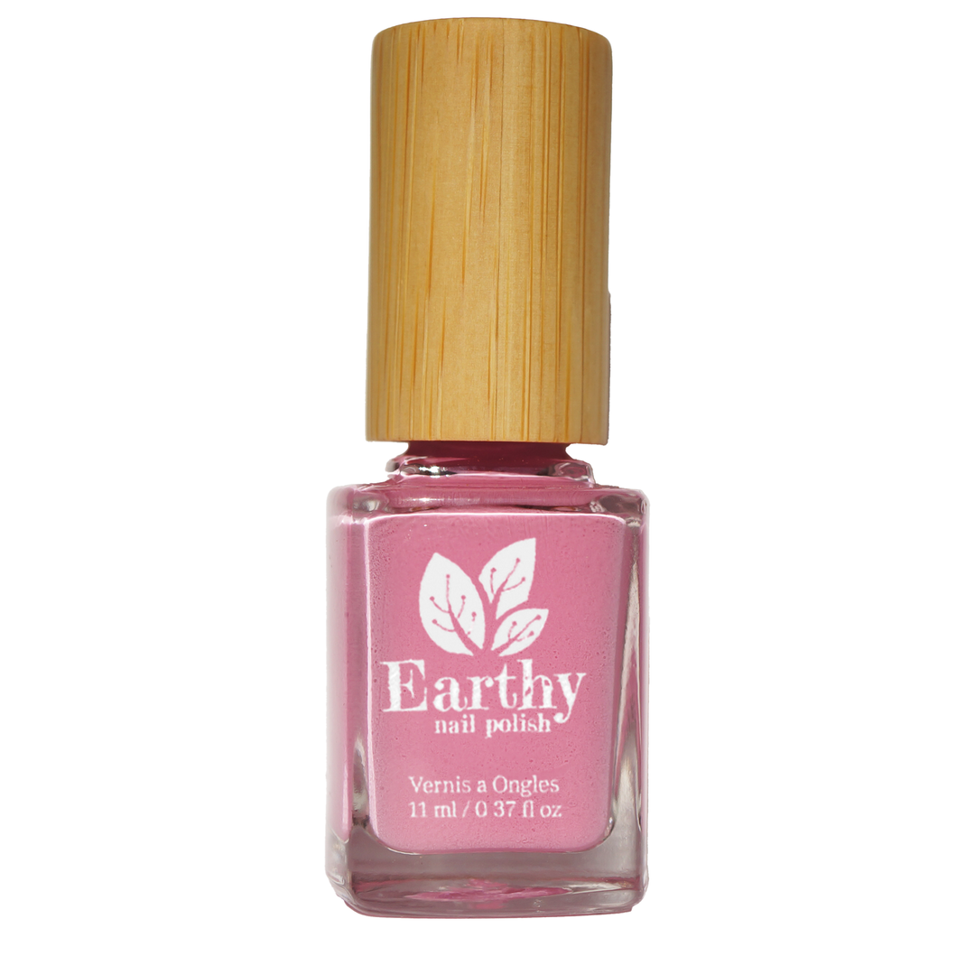Pink plant based nail polish bottle by Earthy with a wooden cap on a white background