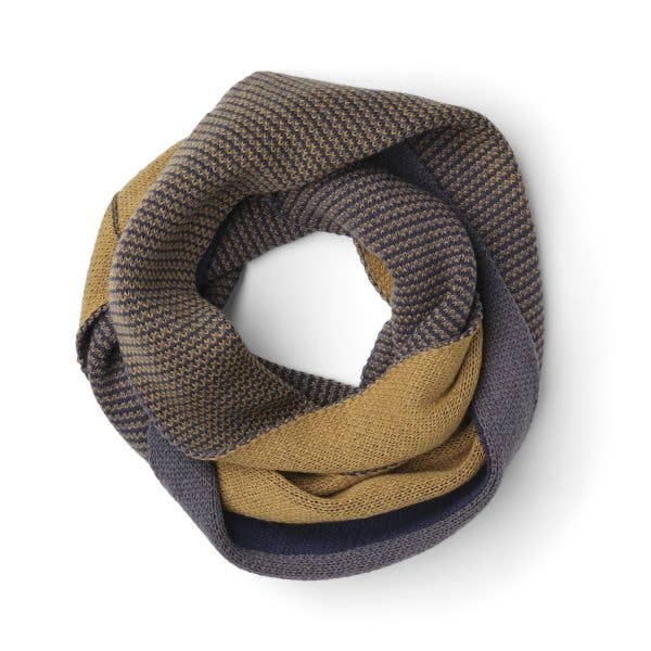 Knitted scarf in brown and beige colors on a white background