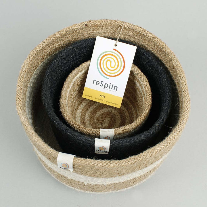 Natural Jute Basket Set – Pebble Cream and White with horizontal lines, Medium Sized Black basket, Small White and cream horizontal lines. Stacked inside one another.