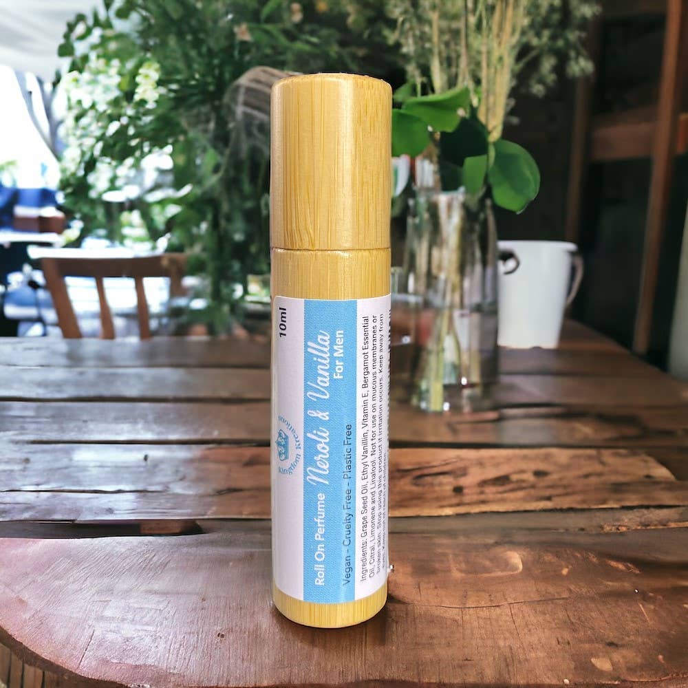 Bottle of Nogli &amp; Vanilla perfume on a wooden table with a blurred background