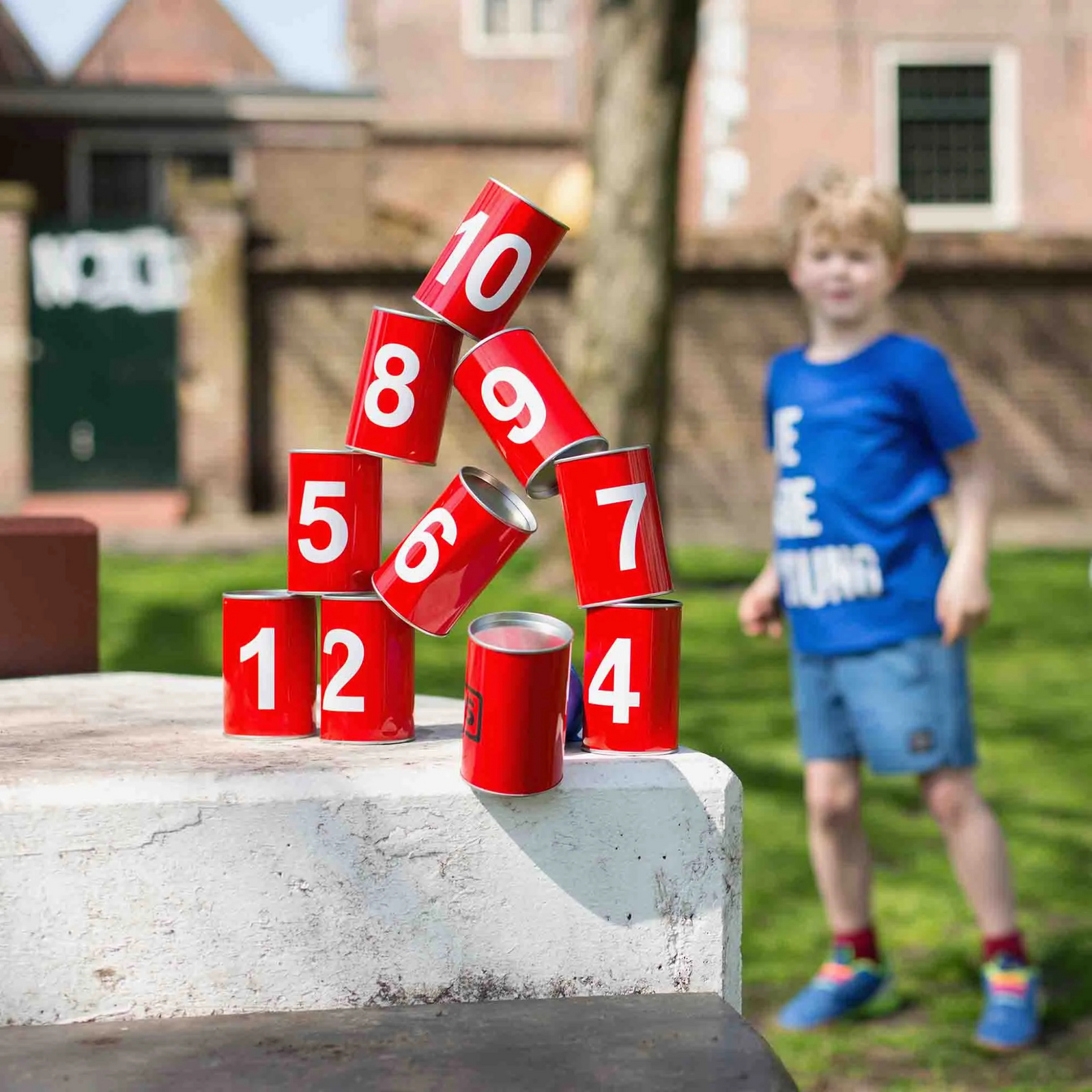Carnival style Game - Knock The Cans Down. Comes with 10 Red Cans 3 coloured bean bags.