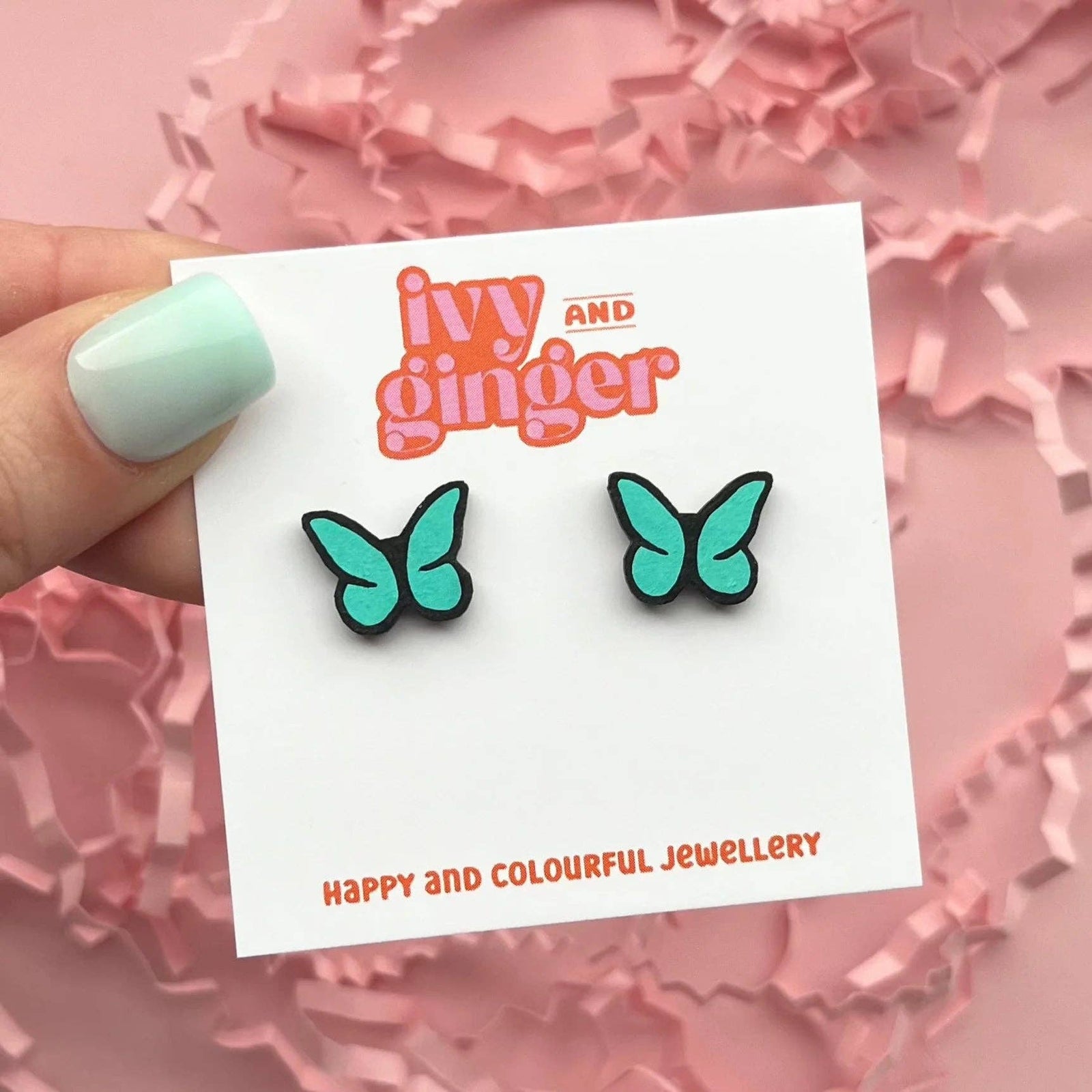 Teal and black butterfly stud earrings with surgical steel findings.