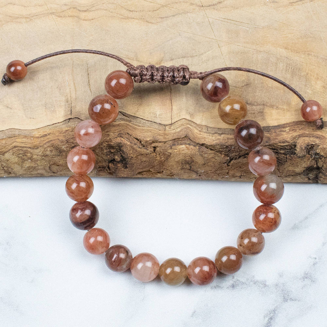 'Ease through any transition in life with calmness and positivity.'

Our Transform bead bracelet has been made to bring you closer to earth and natural touch with the natural brown stone beading.