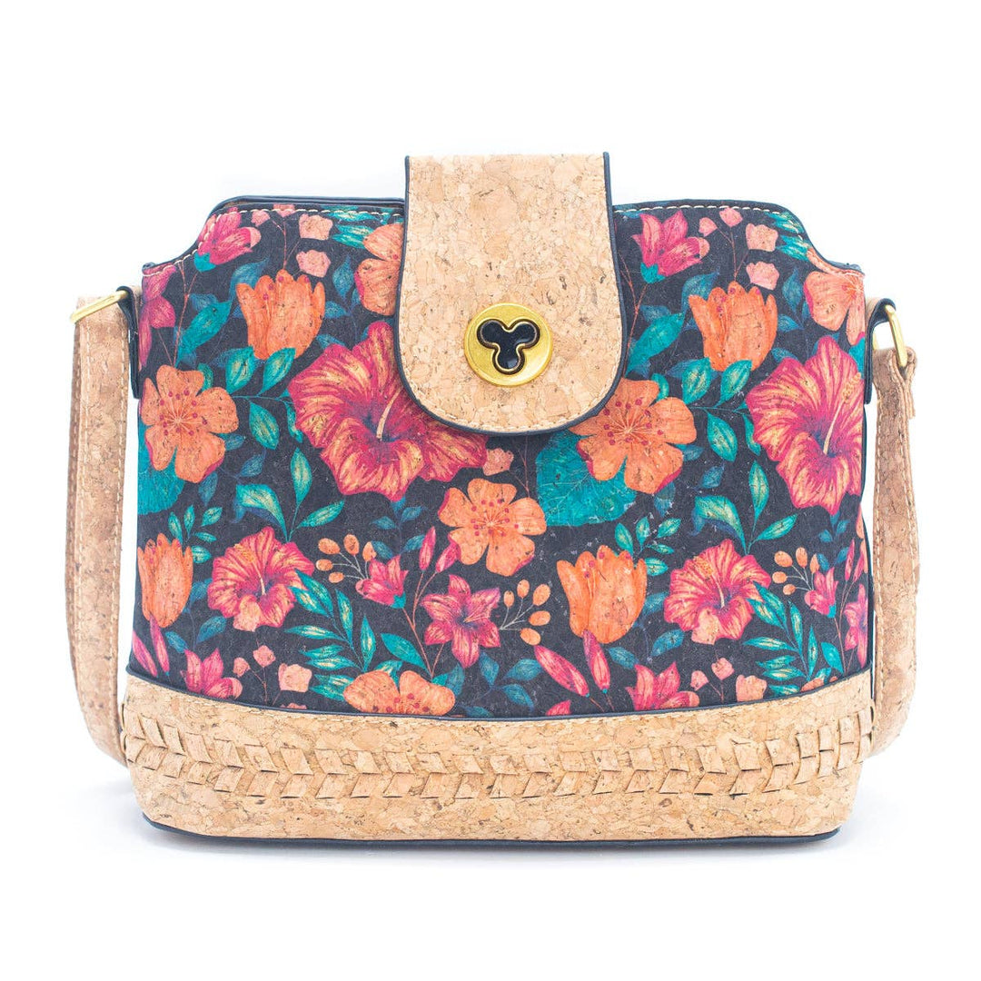 Floral patterned handbag with cork accents on a white background