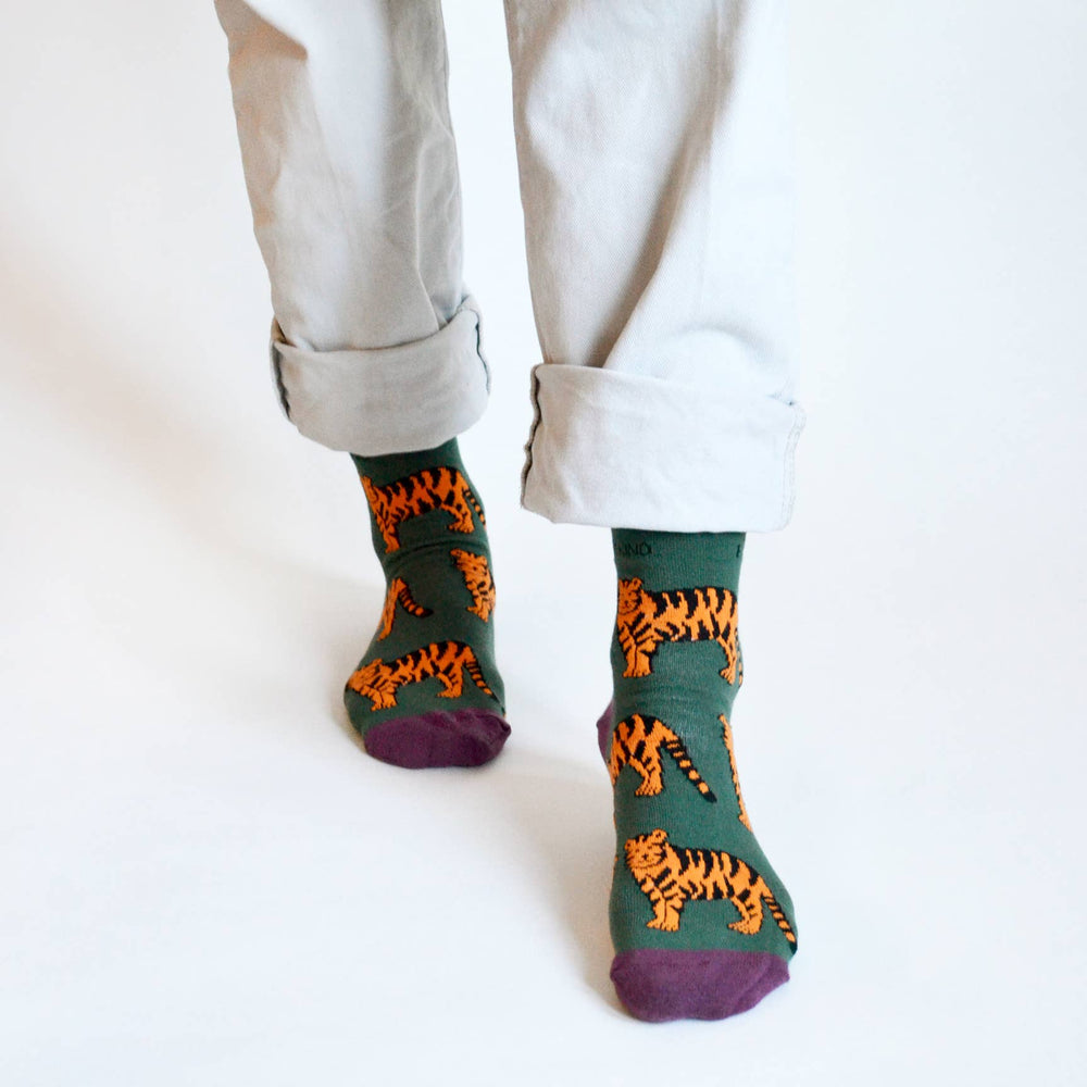 Bamboo socks with tiger print on green and purple socks.