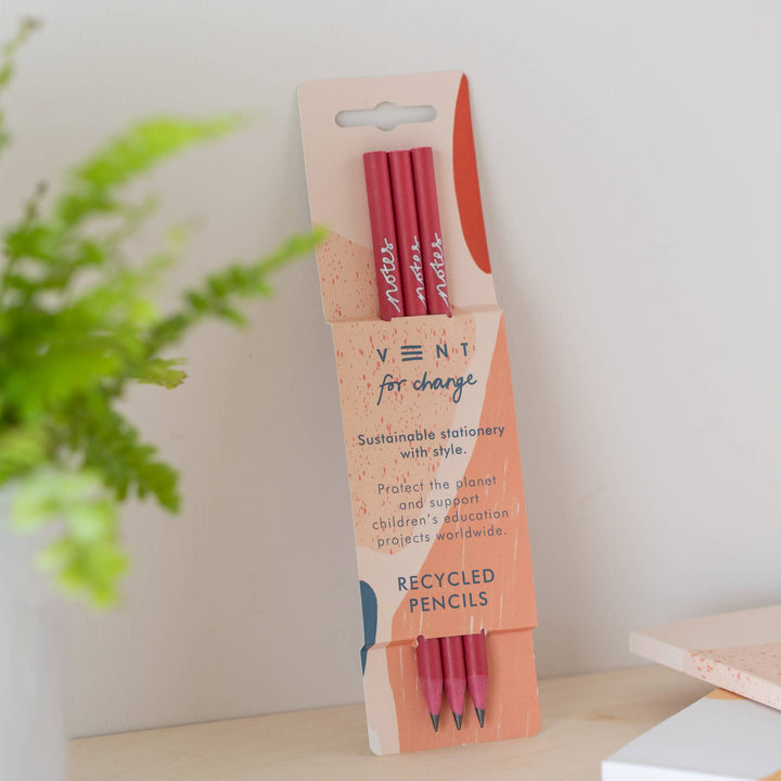 Pack of 3 recycled pencils in coral Notes pencil sleeve. Pencils finished with a stunning silver embossed ‘notes’.