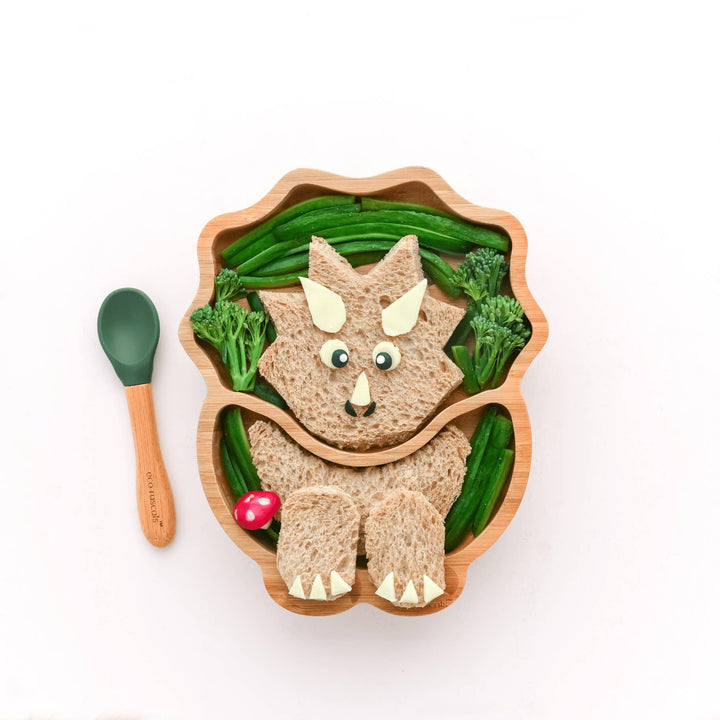 Children's suction plate in a dinosaur shape.