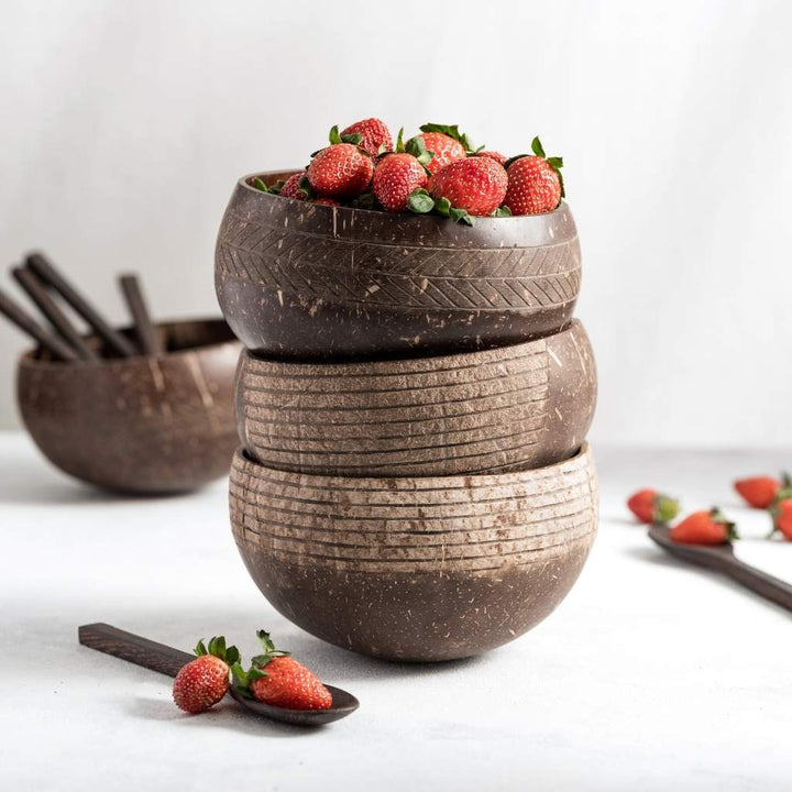 Natural coconut bowl & spoon with a striped pattern.