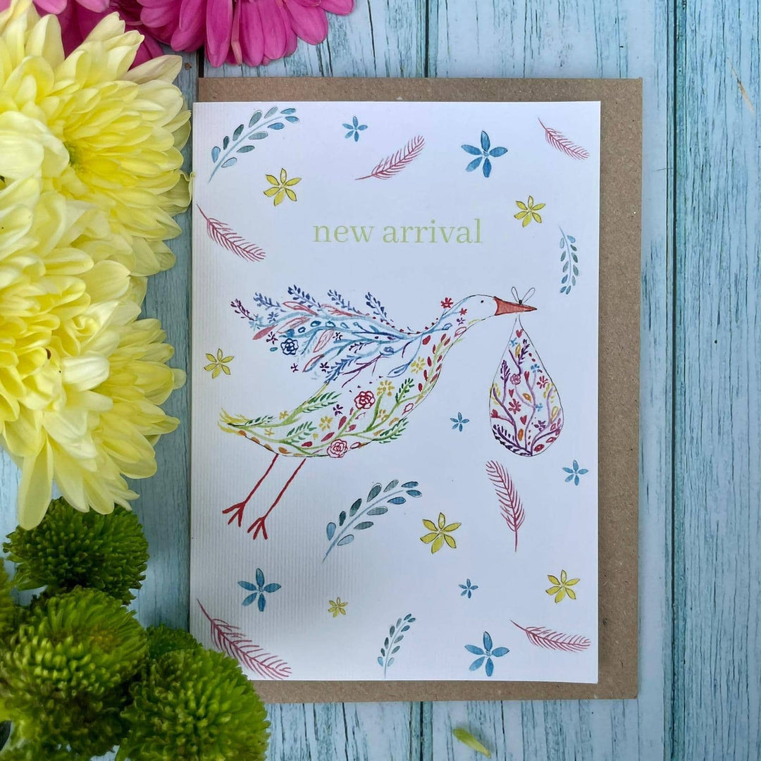 New Arrival card with a beautiful, colourful stork. Eco friendly card send with a recycled Kraft envelope and compostable sleeve.