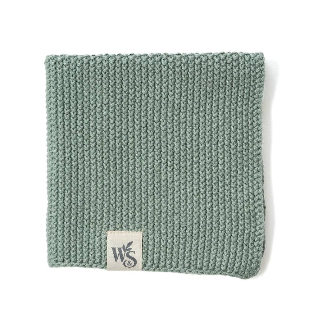 Organic cotton dishcloth in moss green colour.