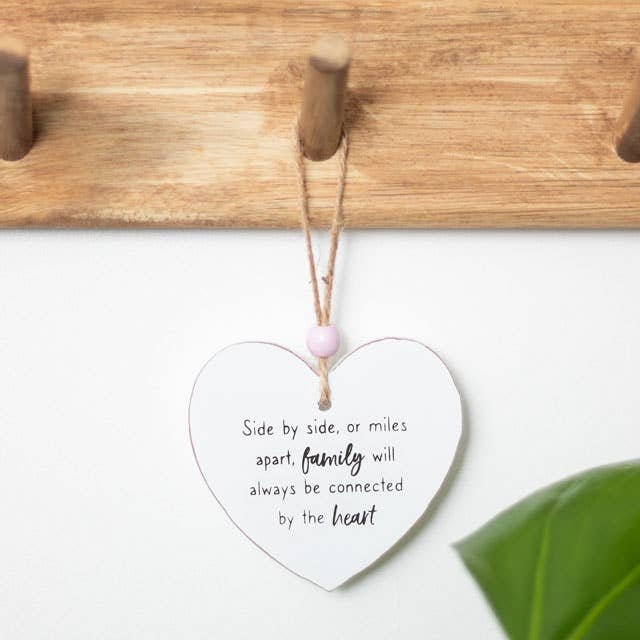 Wooden hanging heart sign with message Side by side or miles apart, family will always be connected by the heart.  