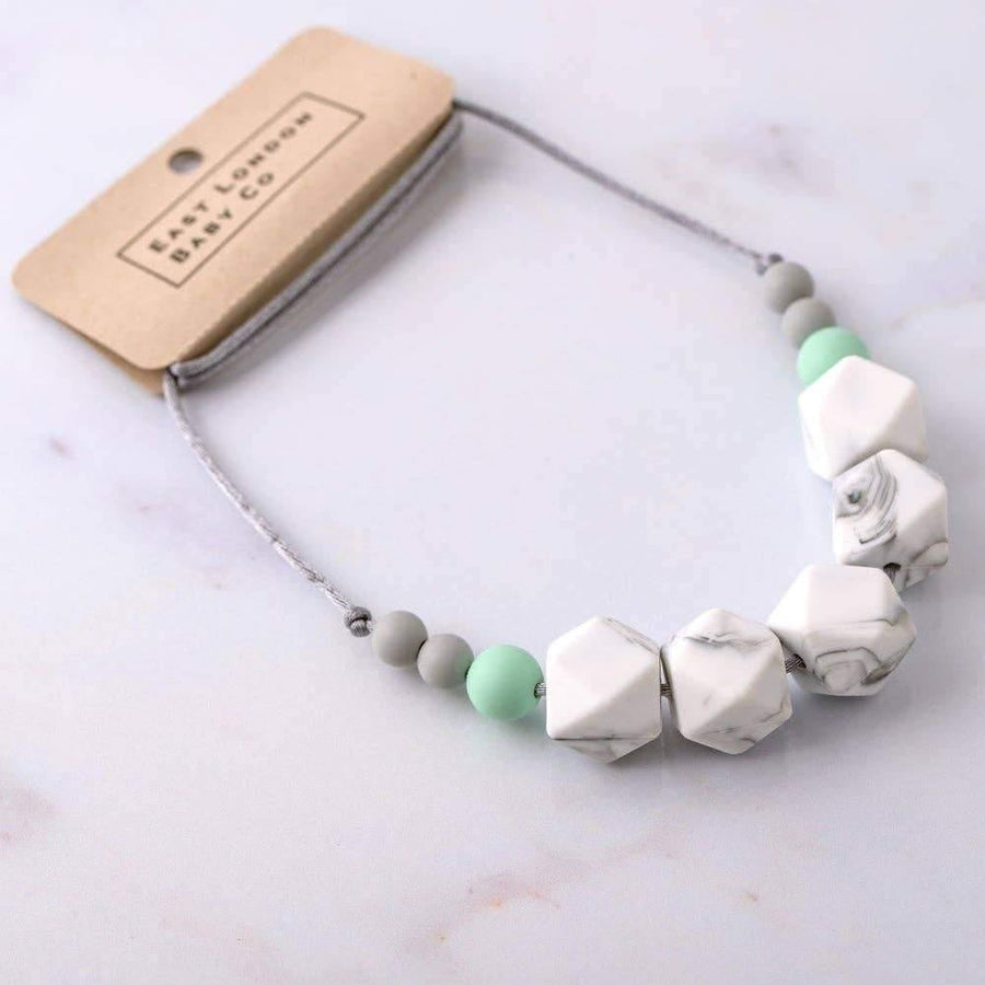 Teething safe silicone necklace Dalston is a cool mix of marble, mint and grey beads on grey cord.